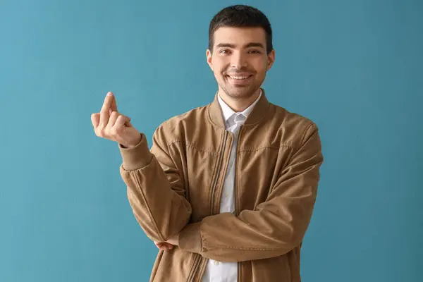 Young Man Snapping Fingers Blue Background — Stock Photo, Image