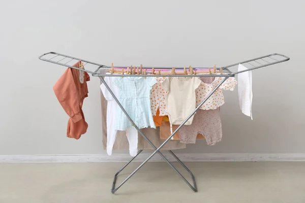 Clean Baby Clothes Hanging Dryer White Wall — Stock Photo, Image