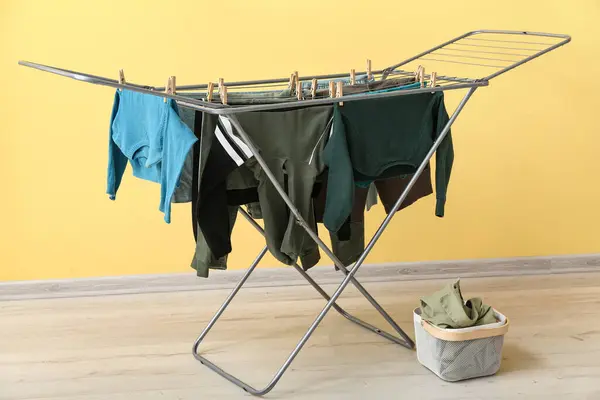 Clean Clothes Hanging Dryer Yellow Wall — Stock Photo, Image