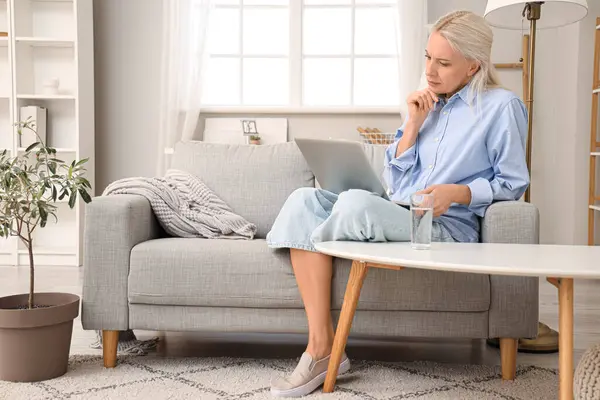 Mature Woman Video Chatting Doctor Home — Stock Photo, Image