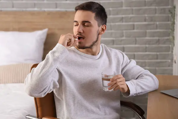 Young Man Glass Water Taking Pills Bedroom — Stock Photo, Image