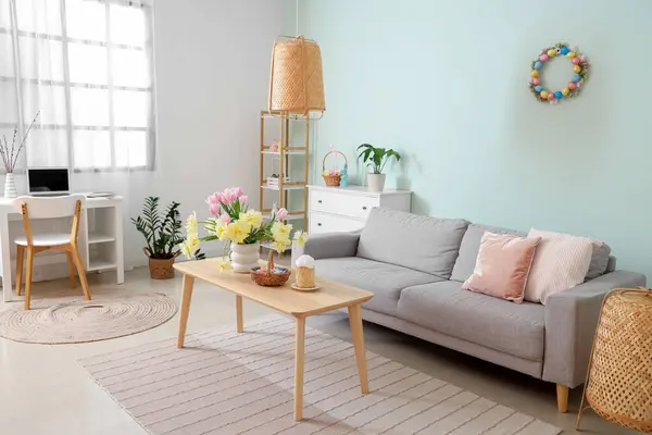 Modern living room with Easter basket and cake on table