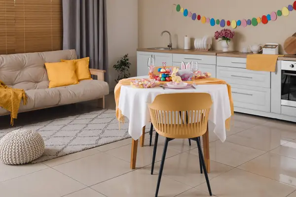 Interior of modern kitchen with festive table serving for Easter celebration