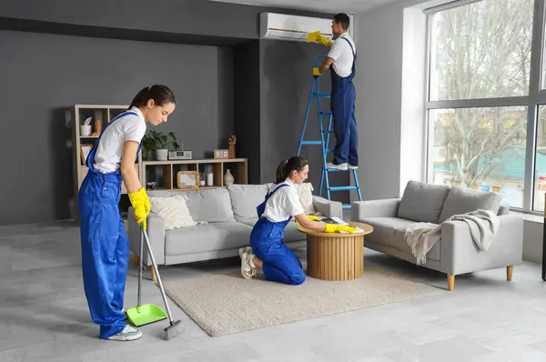 Young Janitors Cleaning Room — Stock Photo, Image