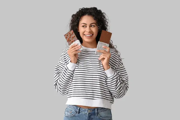 Happy Young African American Woman Sweet Chocolate Bars Grey Background — Stock Photo, Image
