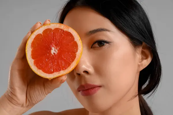 Pretty Young Asian Woman Grapefruit Grey Background — Stock Photo, Image