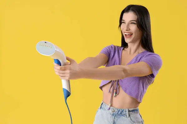 Pretty Young Woman Modern Garment Steamer Yellow Background — Stock Photo, Image