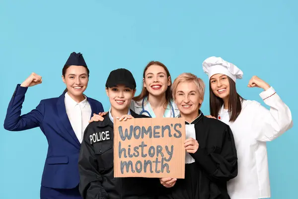 Women of different professions holding cardboard with text WOMEN\'S HISTORY MONTH on blue background