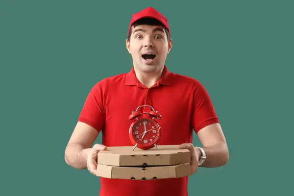 Male Courier Alarm Clock Pizza Boxes Green Background — Stock Photo, Image
