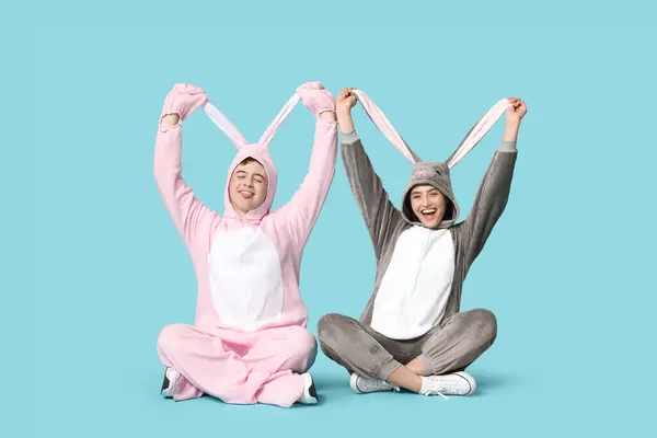 Happy Young Couple Bunny Costume Sitting Blue Background Easter Celebration — Stock Photo, Image