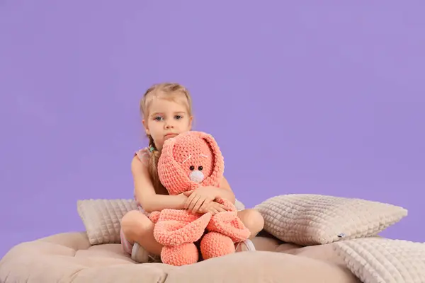 Little Girl Autistic Disorder Toy Bunny Sitting Pouf Lilac Background — Stock Photo, Image