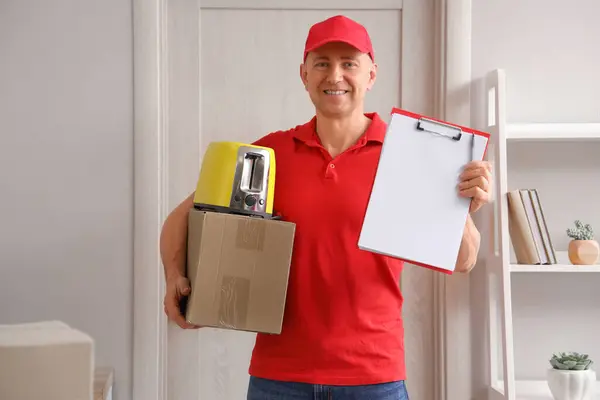 Male Courier New Toaster Parcel Clipboard Home — Stock Photo, Image