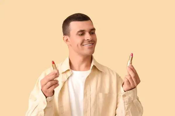 Male Makeup Artist Lipsticks Beige Background — Stock Photo, Image