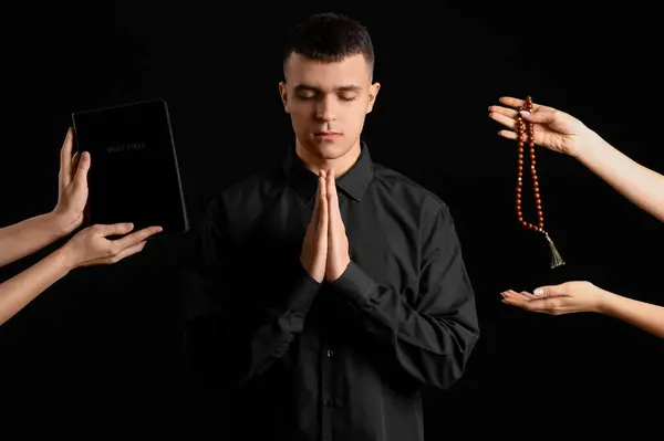 Young Man Praying Hands Holding Rosary Beads Bible Black Background — Stock Photo, Image