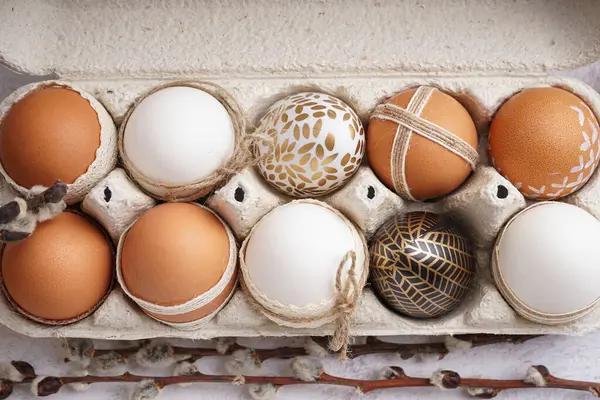 stock image Paper holder with decorated Easter eggs and willow branches on white background, closeup