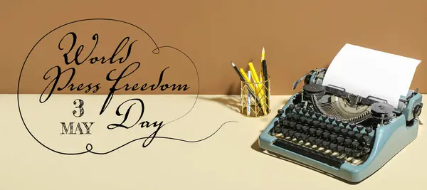 Vintage typewriter on table. Banner for World Press Freedom Day