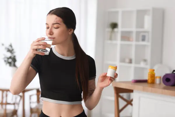 Sporty Young Woman Bottle Vitamin Supplements Drinking Water Home — Stock Photo, Image