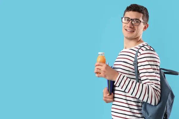 Male Student Bottle Juice Copybooks Blue Background — Stock Photo, Image