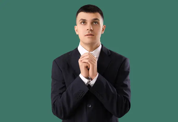 Young Man Praying Green Background — Stock Photo, Image
