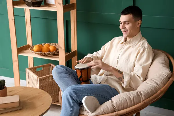 Young Man Playing Drum Armchair Home — Stock Photo, Image