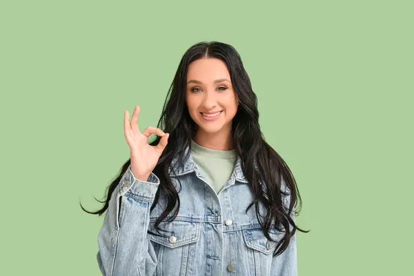Beautiful Young Woman Dark Wavy Hair Denim Jacket Showing Green — Stock Photo, Image
