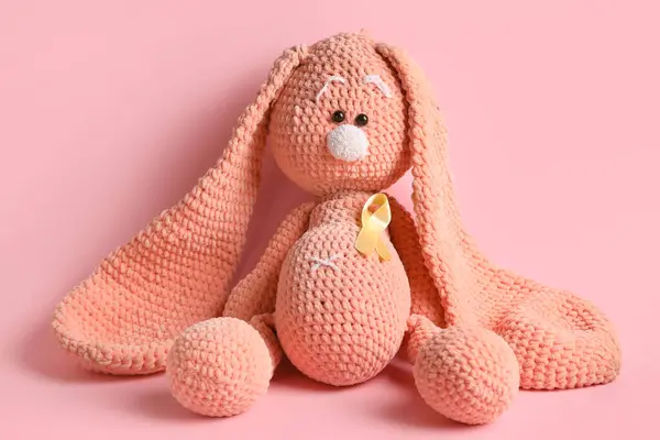 Toy Bunny Golden Ribbon Pink Background Childhood Cancer Awareness Concept — Stock Photo, Image