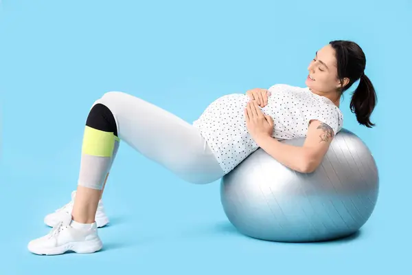 Beautiful Young Pregnant Woman Training Fitball Blue Background — Stock Photo, Image