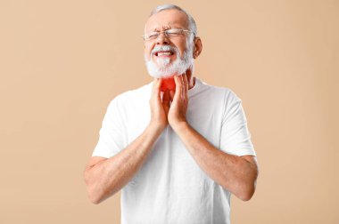 Ill mature man with sore throat on beige background clipart