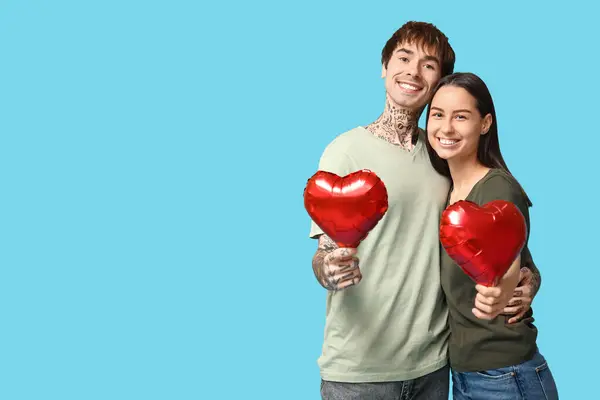 Young Couple Heart Shaped Air Balloons Blue Background — Stock Photo, Image
