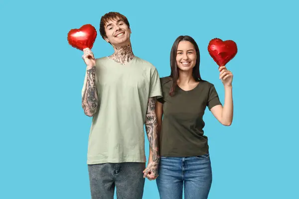 Young Couple Heart Shaped Air Balloons Blue Background — Stock Photo, Image