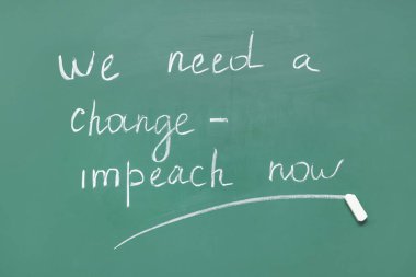 Text WE NEED A CHANGE - IMPEACHMENT NOW written on chalkboard clipart
