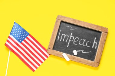 Chalkboard with word IMPEACH and USA flag on yellow background clipart