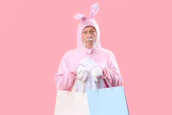 Senior Man Easter Bunny Costume Shopping Bags Pink Background — Stock Photo, Image