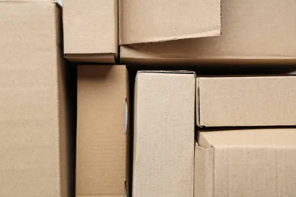 Many Cardboard Boxes Background Closeup Stock Photo