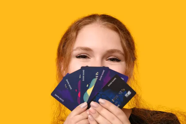 Beautiful Young Woman Credit Cards Yellow Background — Stock Photo, Image