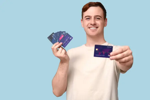 Young Man Credit Cards Blue Background — Stock Photo, Image