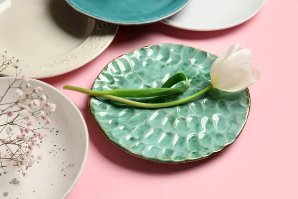 stock image Beautiful table setting with white tulip and gypsophila flowers on pink background