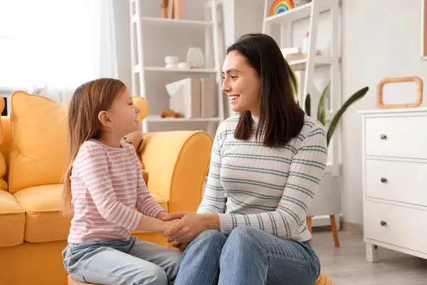 stock image Female psychologist with little girl holding hands in office