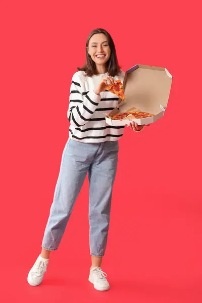 Young Woman Holding Cardboard Box Tasty Pizza Red Background — Stock Photo, Image