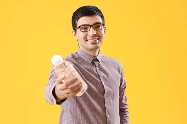 Young Man Bottle Water Yellow Background — Stock Photo, Image