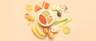 Healthy baby food on beige background clipart