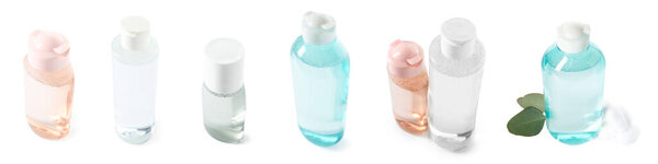 Set of many bottles of micellar water on white background