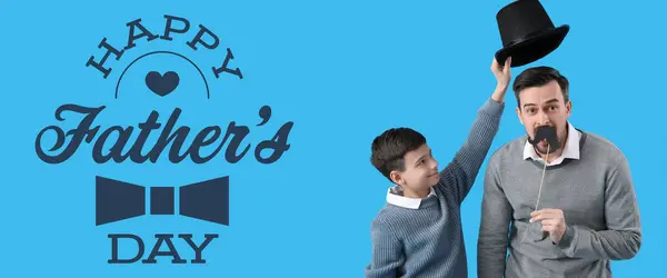 Happy little boy and his dad with hat and paper mustache on light blue background. Greeting banner for Father\'s Day