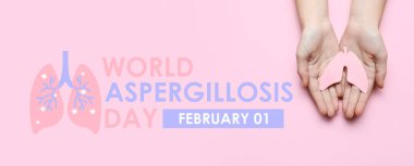 Female hands with paper lungs on pink background. Banner for World Aspergillosis Day clipart