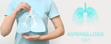 Woman with paper lungs on light background. Banner for World Aspergillosis Day clipart