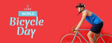 Kırmızı arka planda bisiklete binen genç adam. Dünya Bisiklet Günü için Pankart