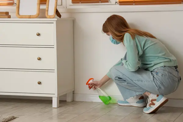 Young Woman Removing Mold Wall Commode Bedroom Immagine Stock