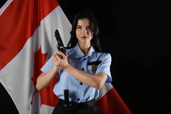 Female police officer with gun and flag of Canada on black background