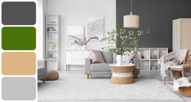 Oturma odasının içindeki sehpanın üzerindeki vazoda çiçek açan dallar. Farklı renk desenleri