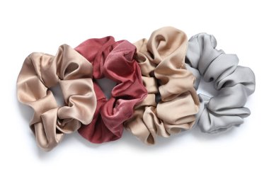 Trendy silk scrunchies on white background clipart
